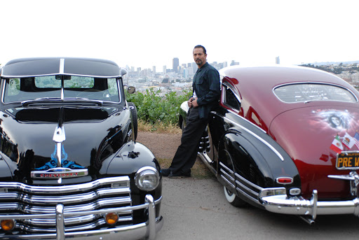 Benjamin Bratt with cars from La Mission